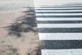 Close up of pedestrian crosswalk on city car parking