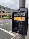 Pedestrians wait traffic lights