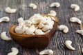 close-up of peeled cashews on the kitchen table in a wooden plate Royalty Free Stock Photo