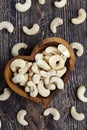 close-up of peeled cashews on the kitchen table in a wooden plate Royalty Free Stock Photo