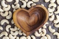 close-up of peeled cashews on the kitchen table in a wooden plate Royalty Free Stock Photo