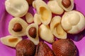 Close up of peeled, cuted and whole pieces of Snake fruit with seed.  Top view of healthy fruit. Salak pondoh is one of the salak Royalty Free Stock Photo