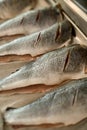 close-up of peeled and gutted fish with incisions on a baking sheet Royalty Free Stock Photo