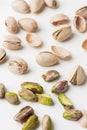 Close up of peeled pistachio nut seeds isolated on the white background. Salted dried beer snack. Macro shot Royalty Free Stock Photo