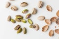 Close up of peeled pistachio nut seeds isolated on the white background. Salted dried beer snack. Macro shot Royalty Free Stock Photo