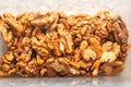 Close-up peeled walnut kernels in a plastic storage container Royalty Free Stock Photo