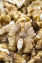 Close-up of peeled walnuts. food background. Vertical view Royalty Free Stock Photo