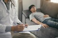 Close up of pen doctor writing with came to visit the patient at home while he was suffering from stomach ulcers and noted the tre Royalty Free Stock Photo