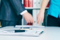 Close-up the pen lies on the documents. Business people hands pointing analyzing at the documents on the background Royalty Free Stock Photo