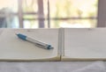 Close up of pen in notebook on office desk Royalty Free Stock Photo