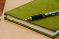 Close up Pen on notebook, vintage style Royalty Free Stock Photo