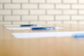 Close up pen on table in empty corporate conference room before business meeting Royalty Free Stock Photo