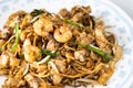 Close-up on Penang char kuey teow is popular fried noodle with coceral, shrimp and eggs in black sauce in Malaysia Royalty Free Stock Photo