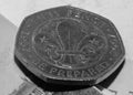 Close up of 50 pence coin with Fleur De Lis symbol