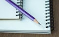 Close up pencil and spiral notebook on wood table Royalty Free Stock Photo
