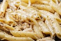 Close up Penne Rigate noodles and Carbon Pasta Sauce