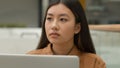 Close up pensive Asian woman working on laptop thinking solution chinese girl japanese korean student look away think