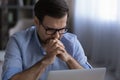 Unhappy man work on laptop frustrated with business problem Royalty Free Stock Photo