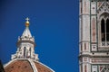 Close-up of people on the dome of the Santa Maria del Fiore Cathedral and Giotto`s Campanile in Florence. Royalty Free Stock Photo