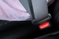 Close Up of people fastening seat safety belt in car for safety before driving Royalty Free Stock Photo