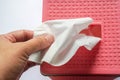 close up people hand pull tissue sheet from the pink box for cleaning Royalty Free Stock Photo