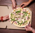 Close-up Of People Hands Taking Slices Of Pizza. Group Of Friends Sharing Pizza Together. Eating Food. Fast Food, Friendship, Royalty Free Stock Photo