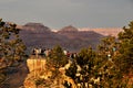 Close-up of people standing on a viewpoint of the south rim trail of the Grand Canyon during sunset..Grand Canyon Village AZ - 25