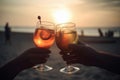 Close up of people toasting with alcoholic drink on a beach, created with Generative AI technology. Royalty Free Stock Photo