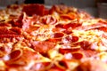 Pepperoni Pizza with Crispy Pepperonis on Table- Close up Royalty Free Stock Photo
