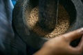 Close up of peppers being crushed in a mortar Royalty Free Stock Photo