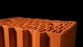 Close up of perforated ceramic blocks with round holes on black background. Stock footage. Materials for the