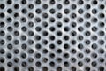 Close up of perforated holes in metal