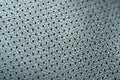 Close-up of perforated leather. trim gray leather for car seats