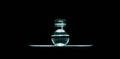 Close-up of perfume bottle isolated on black background. Panoramic studio photo. Tidewater green of color, 2021 trend.
