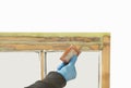 Close up of a person applying dry seal to restored sash windows Royalty Free Stock Photo