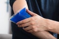 Person Applying Ice Gel Pack On An Injured Elbow Royalty Free Stock Photo