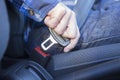 Close Up Of Person In Car Fastening Seat Belt Royalty Free Stock Photo