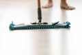 Close up of person cleaning floor with mop Royalty Free Stock Photo