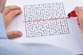 Person Drawing Straight Red Line Over Maze Royalty Free Stock Photo