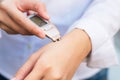 Close-up of person hand checking skin hand with Dermatoscope. Royalty Free Stock Photo