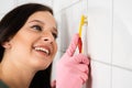 Person Cleaning The White Tile Using Brush Royalty Free Stock Photo