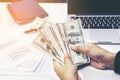 Close-up Of Person Hand Giving Money To Other Hand Royalty Free Stock Photo