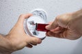 Person Removing Battery From Smoke Detector Royalty Free Stock Photo