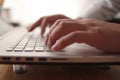 Close up of person hand typing on laptop keyboard, author writing on pc computer, businessman programmer working Royalty Free Stock Photo