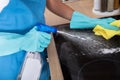 Person Hands Cleaning Induction Stove Royalty Free Stock Photo