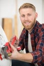 close-up person hands turning knob electric boiler Royalty Free Stock Photo