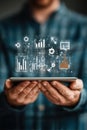 Close-up of a person holding tablet with data analysis icons displayed Royalty Free Stock Photo