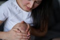 Close-up of a person massaging an injured knee joint. Bruise on the knee. Leg pain