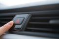 Close-up - the person presses the emergency stop button in the car. Danger on the road Royalty Free Stock Photo