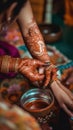 A close up of a person putting henna on another person& x27;s hand. Generative AI image.